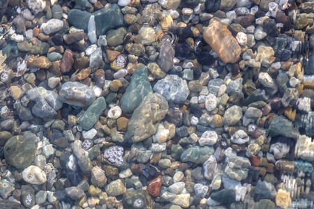 Stone seashore as abstract background .