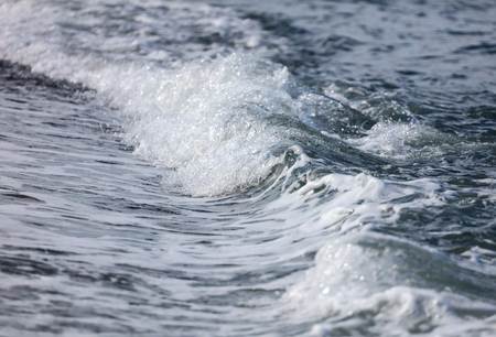 Waves on the seashore as an abstract background .