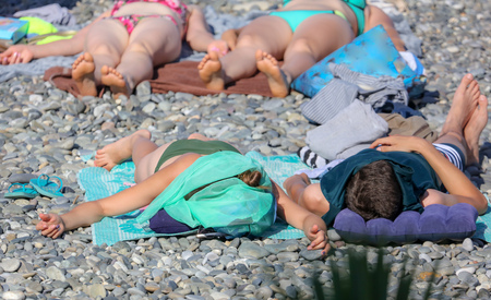 People sunbathe on the beach to the sea .の写真素材