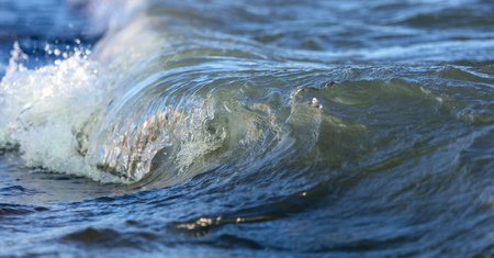 Waves on the seashore as an abstract background .の写真素材