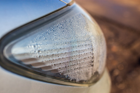 Water drops on the headlights from cars .の写真素材