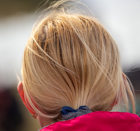 Tailored hair on the girlâ€™s head .