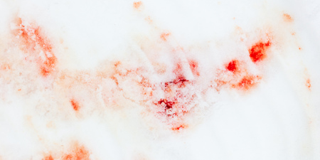 Red blood on white snow as a background.の写真素材