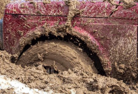 Car wheel slips in the dirt in nature .の写真素材