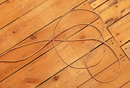 Electric wire on a wooden floor at a construction site .の写真素材