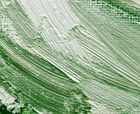 Green oil paint on canvas as abstract background.