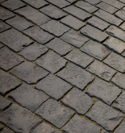 Stone blocks on the road as an abstract background .