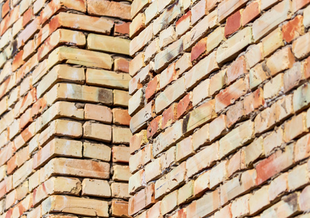 A wall of bricks in a house under construction as an abstract background.
