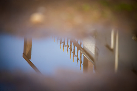 Reflection in a puddle on the road .の写真素材