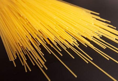 Pasta from dough as an abstract background .の写真素材