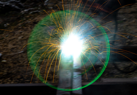 Sparks from welding at a construction site as a background.の写真素材
