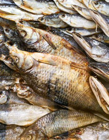 Smoked fish on the counter in the store.