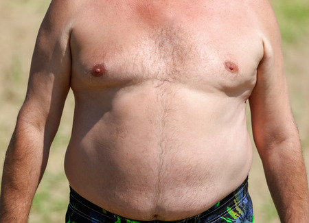A man with a big belly.の写真素材