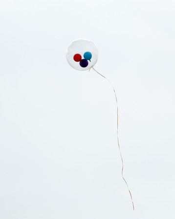Colored balls inside transparent flies in the sky.の写真素材