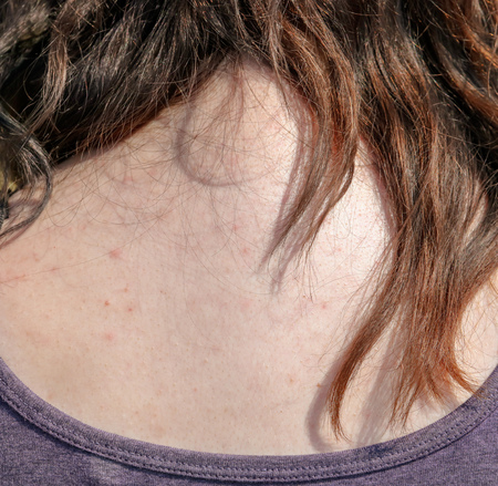 Girl's hair hanging down her back.