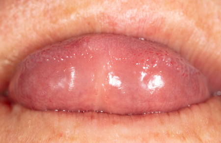 Tongue in a man's mouth. Macroの写真素材
