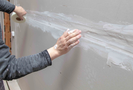 Tape for plaster on the wall. Repair in the house.の写真素材