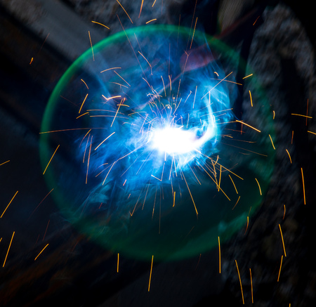 Sparks from welding at a construction site as a background.の写真素材