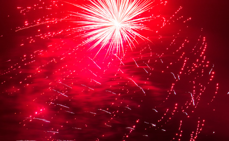 Beautiful sparks from fireworks in the sky at night.の写真素材