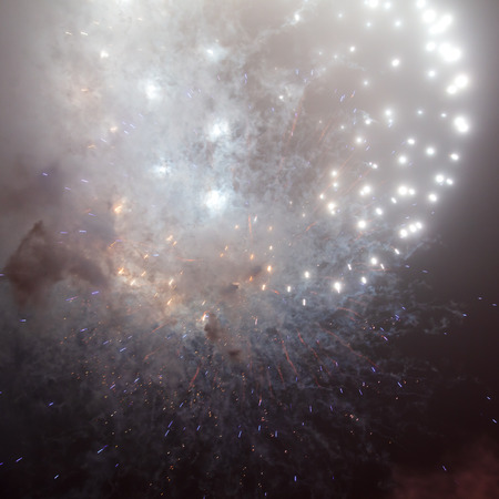 Beautiful sparks from fireworks in the sky at night.