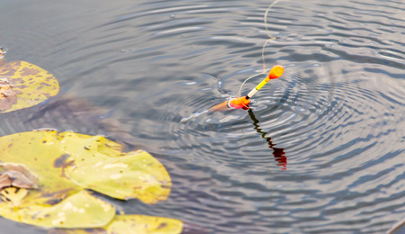 Fisherman float on the surface of the water.