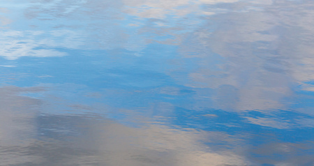 Reflection of the sky on the surface of the water.