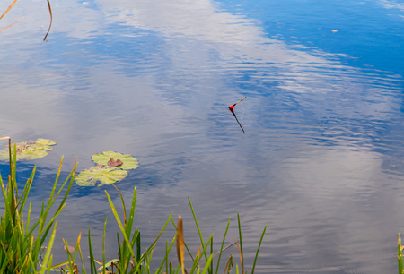Fisherman float on the surface of the water.の写真素材