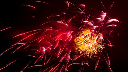 Beautiful sparks from fireworks in the sky at night.の写真素材