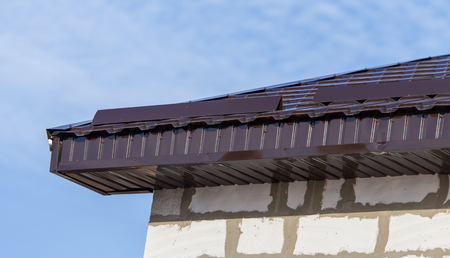 Metal roof in the house against the sky.