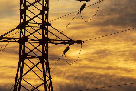 Electric pole at sunset as background.の写真素材