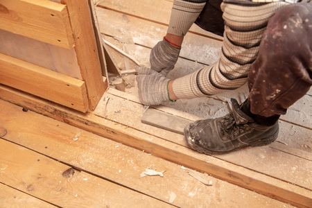 Worker cuts with a knife drywall repair.の写真素材