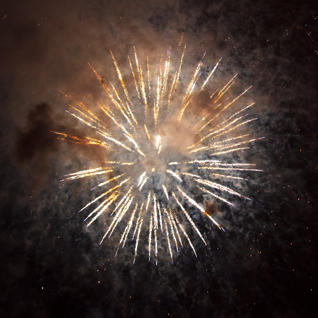 Beautiful sparks from fireworks in the sky at night.