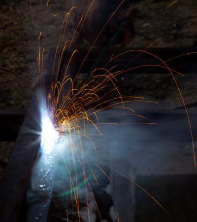 Sparks from welding at a construction site as a background.の写真素材