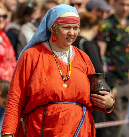 Yelets, Russia - May 11, 2019: Girl in the clothes of ancient Russian people. Historical holiday Rusborg.のeditorial素材
