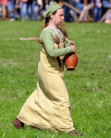 Yelets, Russia - May 11, 2019: Girl in the clothes of ancient Russian people. Historical holiday Rusborg.のeditorial素材