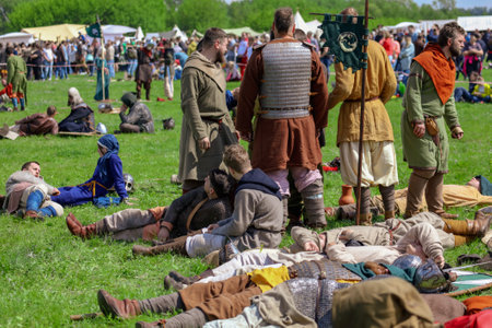Yelets, Russia - May 11, 2019: Knights lie on the grass. Historical holiday Rusborg.のeditorial素材