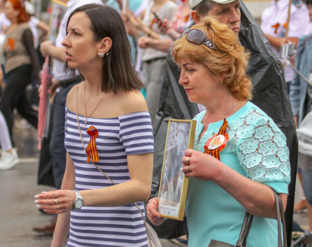 Lipetsk, Russia - May 9, 2019: Action Immortal Regiment. People come with photos of the military in World War II.のeditorial素材
