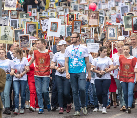 Lipetsk, Russia - May 9, 2019: Action Immortal Regiment. People come with photos of the military in World War II.のeditorial素材