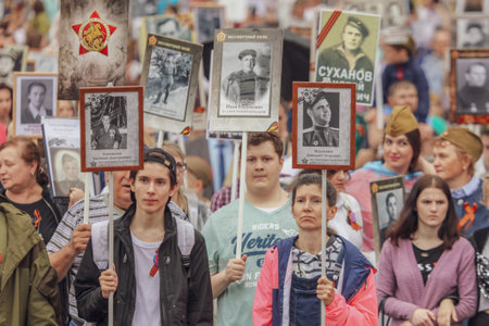 Lipetsk, Russia - May 9, 2019: Action Immortal Regiment. People come with photos of the military in World War II.のeditorial素材
