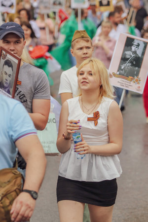 Lipetsk, Russia - May 9, 2019: Action Immortal Regiment. People come with photos of the military in World War II.のeditorial素材