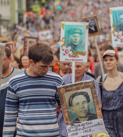 Lipetsk, Russia - May 9, 2019: Action Immortal Regiment. People come with photos of the military in World War II.のeditorial素材