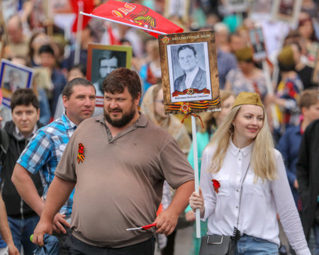 Lipetsk, Russia - May 9, 2019: Action Immortal Regiment. People come with photos of the military in World War II.のeditorial素材