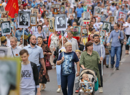 Lipetsk, Russia - May 9, 2019: Action Immortal Regiment. People come with photos of the military in World War II.のeditorial素材