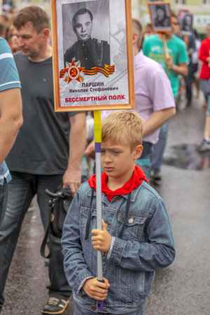 Lipetsk, Russia - May 9, 2019: Action Immortal Regiment. People come with photos of the military in World War II.のeditorial素材