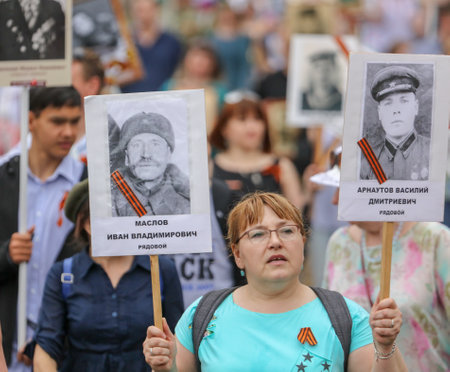 Lipetsk, Russia - May 9, 2019: Action Immortal Regiment. People come with photos of the military in World War II.のeditorial素材