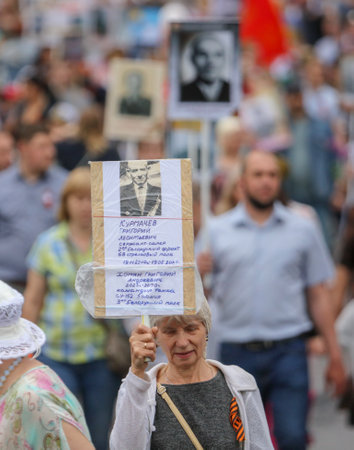 Lipetsk, Russia - May 9, 2019: Action Immortal Regiment. People come with photos of the military in...
