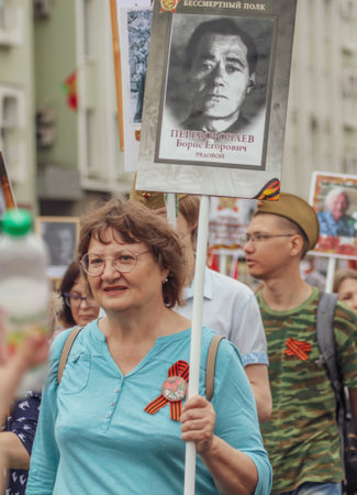 Lipetsk, Russia - May 9, 2019: Action Immortal Regiment. People come with photos of the military in World War II.のeditorial素材
