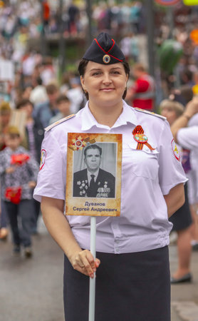 Lipetsk, Russia - May 9, 2019: Action Immortal Regiment. People come with photos of the military in World War II.のeditorial素材