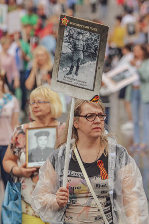 Lipetsk, Russia - May 9, 2019: Action Immortal Regiment. People come with photos of the military in World War II.のeditorial素材