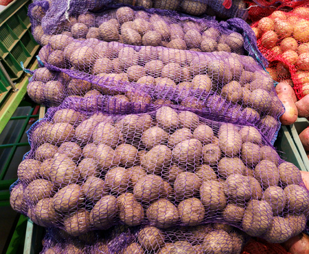Potatoes on the counter in the store .の写真素材